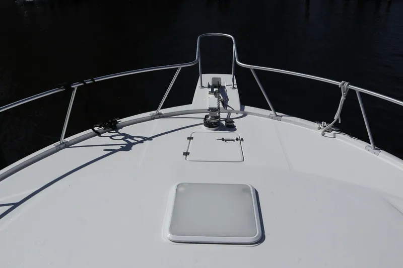  Yacht Photos Pics Bow view of 2005 Luhrs 38 Convertible boat with railing and anchor system.