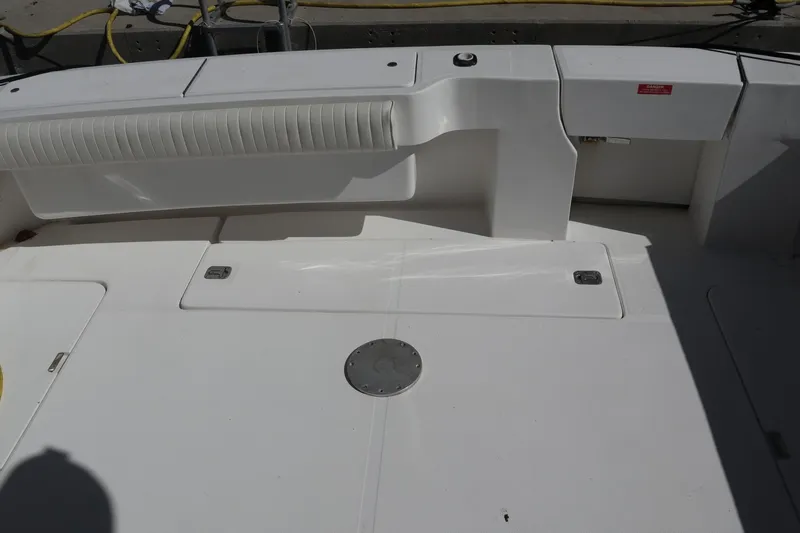  Yacht Photos Pics 2005 Luhrs 38 Convertible boat deck with seating and storage compartments.