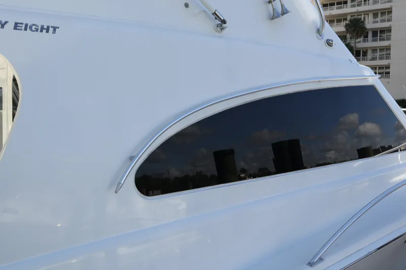  Yacht Photos Pics 2005 Luhrs 38 Convertible yacht with sleek window design and reflective surface.