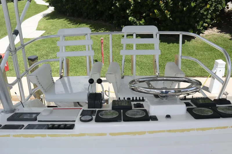  Yacht Photos Pics 2005 Luhrs 38 Convertible boat helm with dual seats and navigation controls.