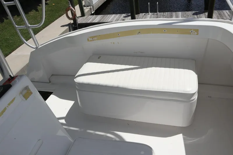  Yacht Photos Pics 2005 Luhrs 38 Convertible boat with white cushioned seating on deck.