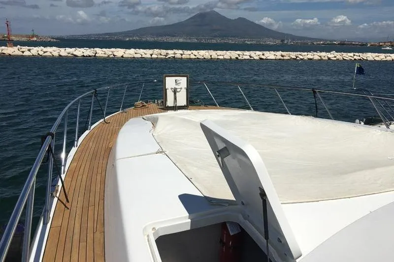  Yacht Photos Pics 2008 Mangusta 80 yacht deck with scenic mountain and ocean view.