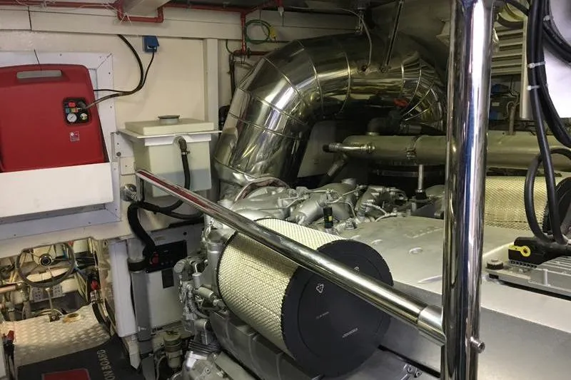  Yacht Photos Pics Engine room of a 2008 Mangusta 80 yacht, featuring complex machinery and piping.