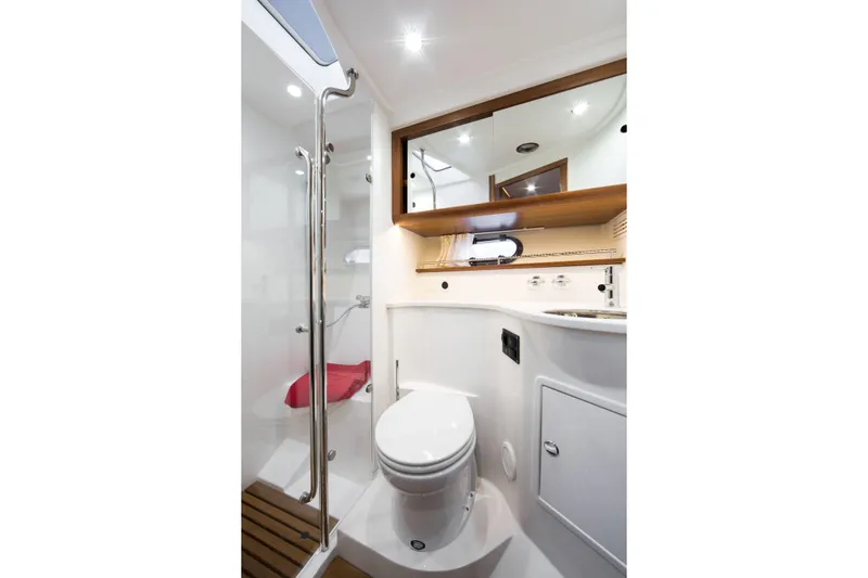  Yacht Photos Pics Luxurious bathroom in 2026 Nimbus 405 Coup&eacute; yacht with modern fixtures and elegant design.