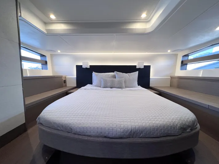 In Stock Yacht Photos Pics Luxurious bedroom interior of 2024 Beneteau Gran Turismo 45 yacht, featuring modern design and ambient lighting.