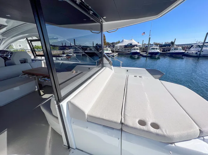 In Stock Yacht Photos Pics 2024 Beneteau Gran Turismo 45 yacht with spacious deck and marina view.