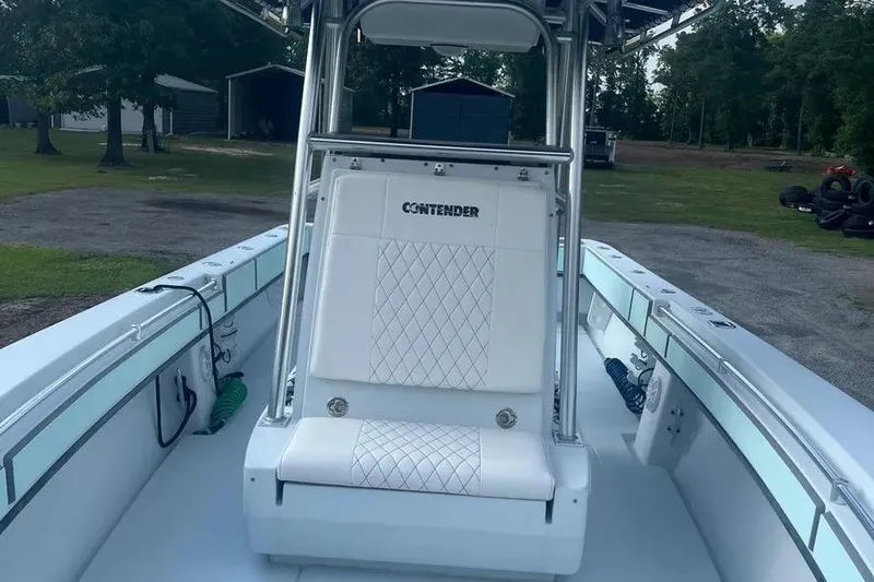  Yacht Photos Pics 2011 Contender 32 ST boat interior with white seating and sleek design.