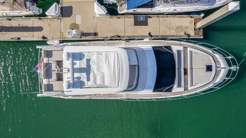 Vivere Yacht Photos Pics Aerial view of a 2016 Azimut 50 yacht docked at a marina.