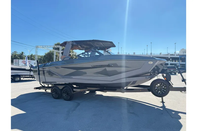  Yacht Photos Pics 2026 Nautique Super Air Nautique G25 Coastal Edition boat on trailer, sunny day.