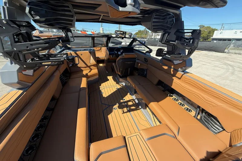  Yacht Photos Pics 2026 Nautique Super Air Nautique G25 Coastal Edition interior with luxurious tan seating.