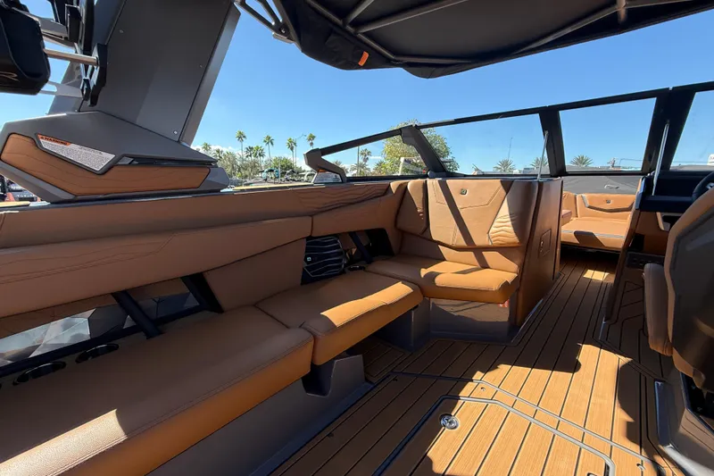  Yacht Photos Pics 2026 Nautique Super Air Nautique G25 Coastal Edition interior with tan seating and sleek design.