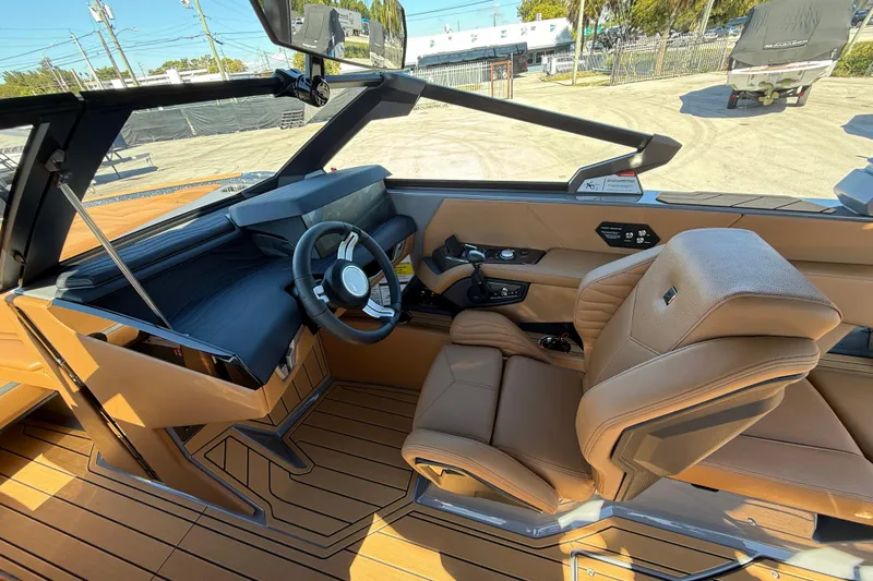  Yacht Photos Pics 2026 Nautique Super Air Nautique G25 Coastal Edition interior with luxurious seating and modern dashboard.