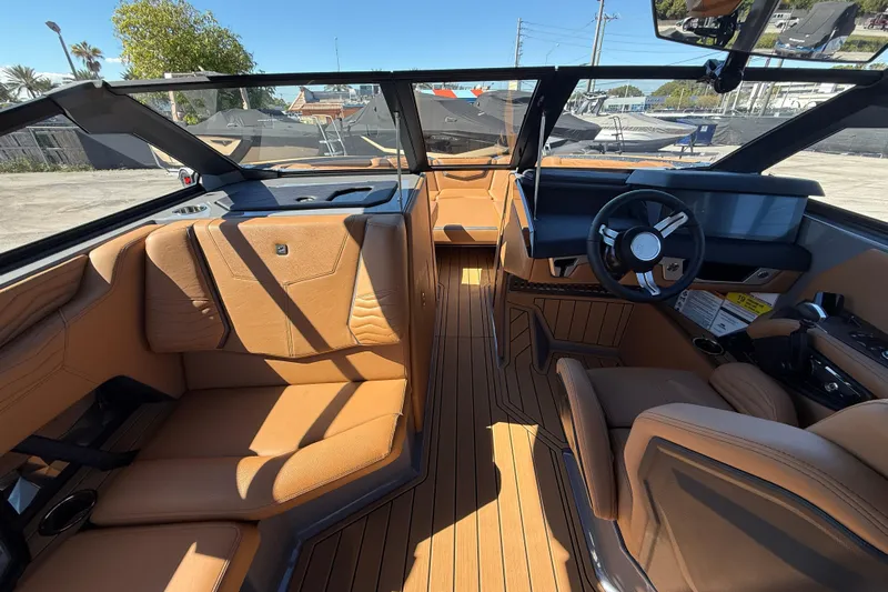  Yacht Photos Pics Interior of 2026 Nautique Super Air Nautique G25 Coastal Edition, featuring luxurious tan seating.
