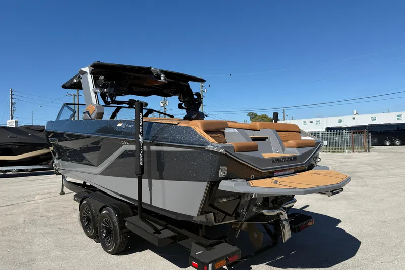  Yacht Photos Pics 2026 Nautique Super Air Nautique G25 Coastal Edition boat on trailer, rear view.