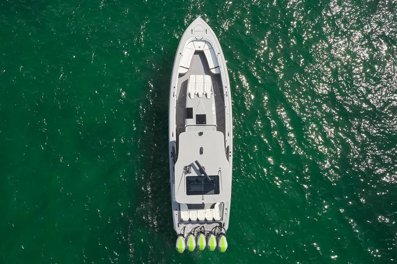  Yacht Photos Pics Aerial view of 2022 Midnight Express 43' Solstice boat on green water.