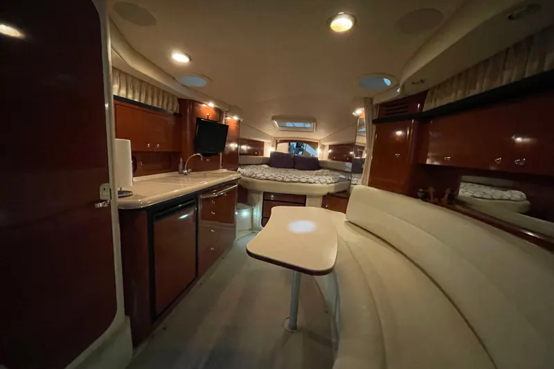 Yacht Photos Pics Luxurious interior of a 2003 Sea Ray 340 Sundancer yacht with elegant seating and modern amenities.