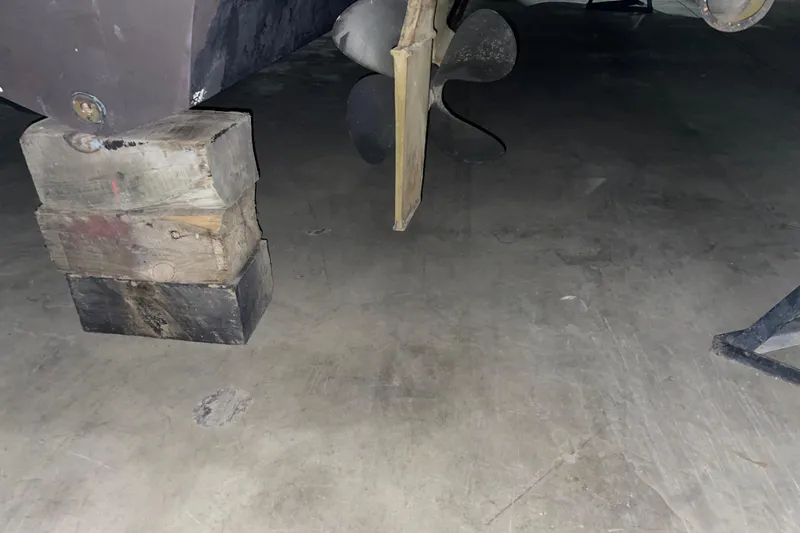  Yacht Photos Pics 2003 Sea Ray 340 Sundancer propeller and hull supported by wooden blocks.