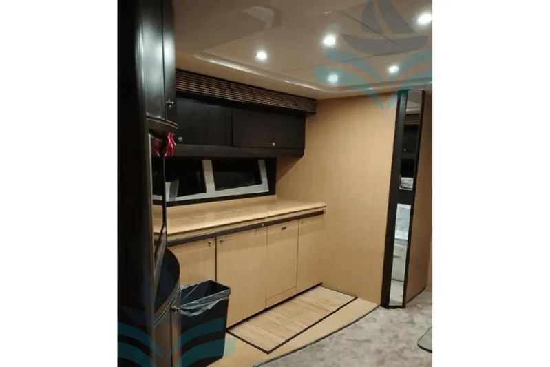  Yacht Photos Pics Interior of 2007 Ferretti Yachts Riva 63 Vertigo, featuring modern cabinetry and lighting.