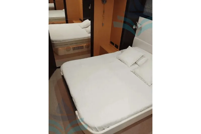  Yacht Photos Pics Luxurious bedroom interior of 2007 Ferretti Yachts Riva 63 Vertigo with elegant bedding.