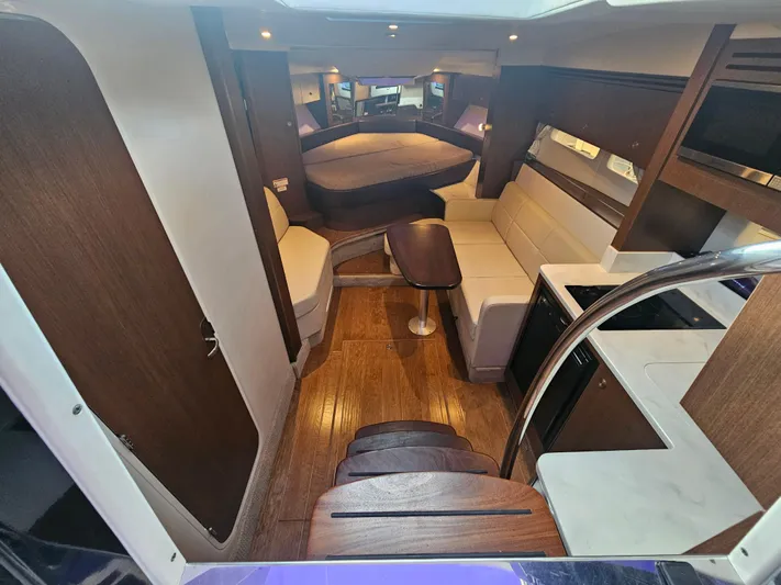 Levon II Yacht Photos Pics Interior of 2017 Sea Ray Sundancer 350 Coupe, featuring wood flooring and modern seating.