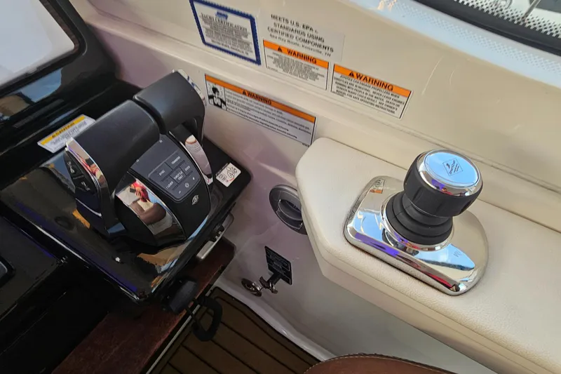 Levon II Yacht Photos Pics Control panel of 2017 Sea Ray Sundancer 350 Coupe with throttle and joystick.