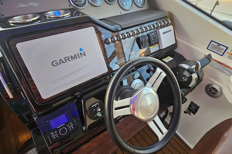 Levon II Yacht Photos Pics 2017 Sea Ray Sundancer 350 Coupe helm with Garmin navigation and modern controls.