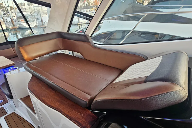 Levon II Yacht Photos Pics Luxurious seating on 2017 Sea Ray Sundancer 350 Coupe yacht, featuring elegant brown upholstery.
