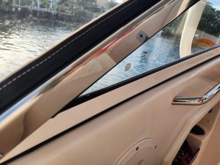  Yacht Photos Pics 2023 Grady-White Freedom 275 boat interior, showcasing window and water view.