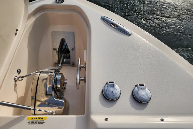  Yacht Photos Pics 2023 Grady-White Freedom 275 boat anchor compartment with winch and deck fittings.