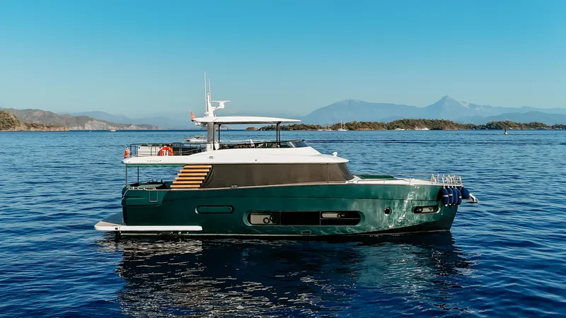  Yacht Photos Pics 2024 Azimut Magellano 66 yacht cruising on serene blue waters.