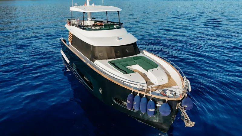  Yacht Photos Pics 2024 Azimut Magellano 66 yacht cruising on clear blue water.