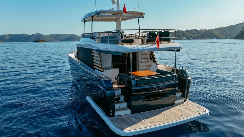  Yacht Photos Pics 2024 Azimut Magellano 66 yacht cruising on serene blue waters.