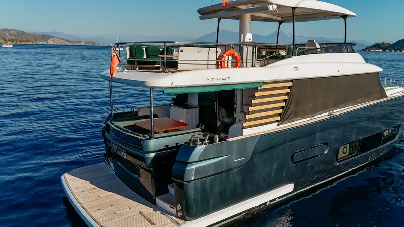  Yacht Photos Pics 2024 Azimut Magellano 66 yacht cruising on serene blue waters.