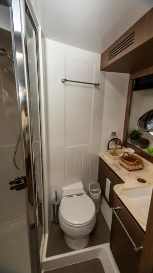  Yacht Photos Pics 2024 Azimut Magellano 66 yacht bathroom with modern fixtures and compact design.