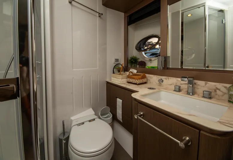  Yacht Photos Pics Luxurious bathroom in 2024 Azimut Magellano 66 yacht, featuring modern fixtures and elegant design.