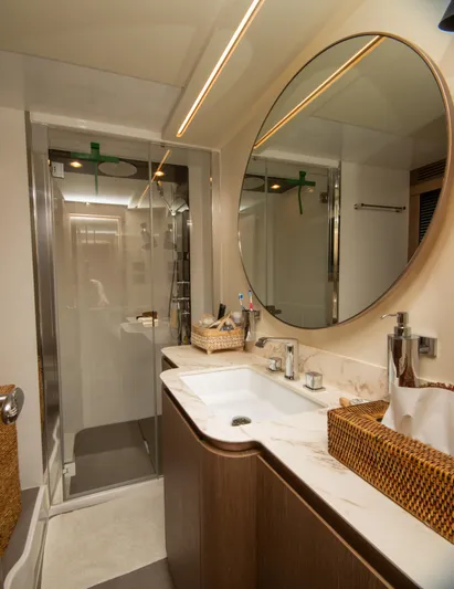  Yacht Photos Pics Luxurious bathroom in 2024 Azimut Magellano 66 yacht with modern fixtures and elegant design.