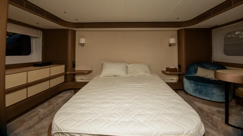  Yacht Photos Pics Luxurious bedroom interior of 2024 Azimut Magellano 66 yacht with modern furnishings.
