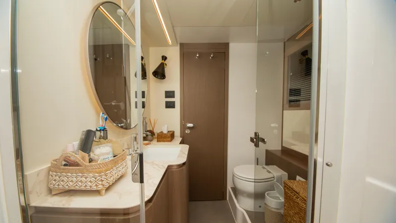  Yacht Photos Pics Luxurious bathroom interior of 2024 Azimut Magellano 66 yacht, featuring modern design and amenities.