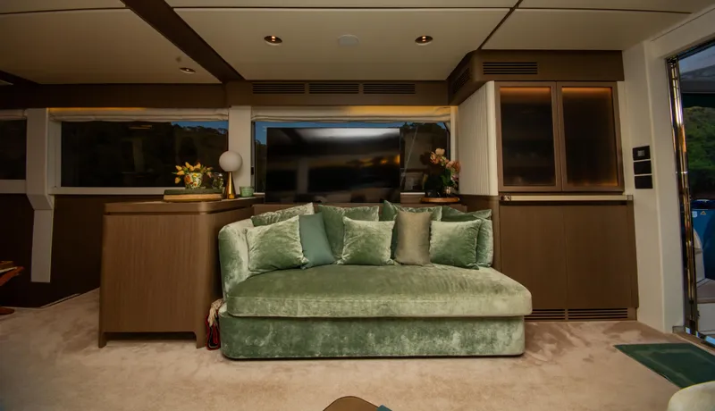  Yacht Photos Pics Luxurious interior of 2024 Azimut Magellano 66 yacht with plush green sofa and elegant decor.