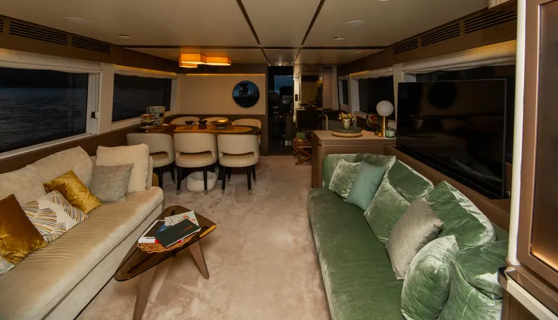  Yacht Photos Pics Luxurious interior of 2024 Azimut Magellano 66 yacht with elegant seating and dining area.