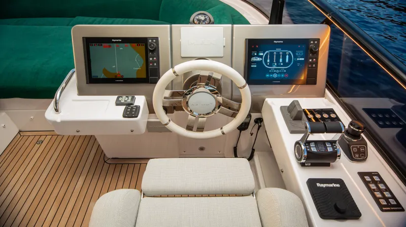  Yacht Photos Pics Helm of 2024 Azimut Magellano 66 yacht with advanced navigation displays.