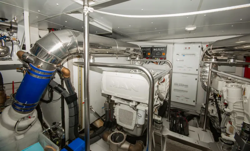  Yacht Photos Pics Engine room of 2024 Azimut Magellano 66 yacht, featuring advanced machinery and piping systems.