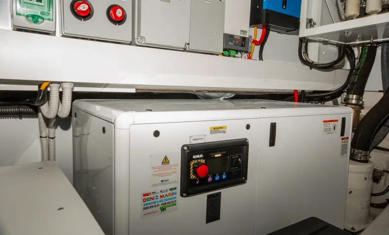  Yacht Photos Pics Engine room of 2024 Azimut Magellano 66 yacht, featuring control panels and equipment.