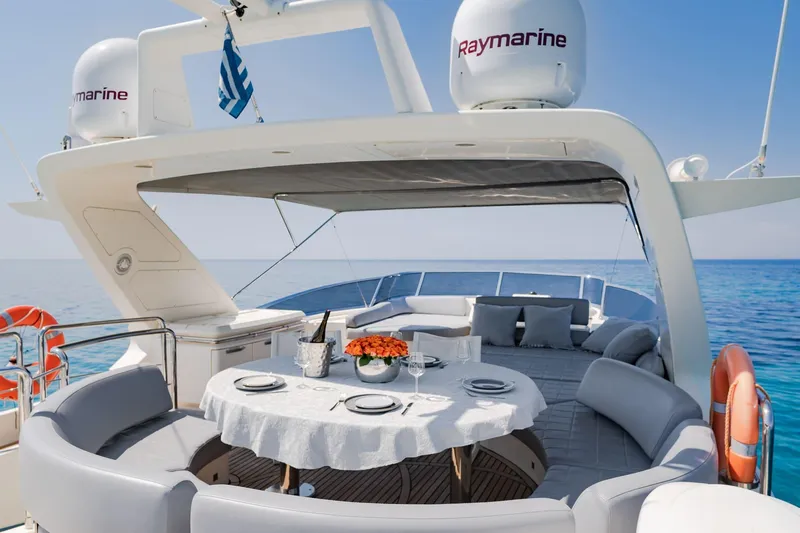 Vea Yacht Photos Pics Luxurious 2008 Azimut 75 yacht deck with elegant dining setup and ocean view.