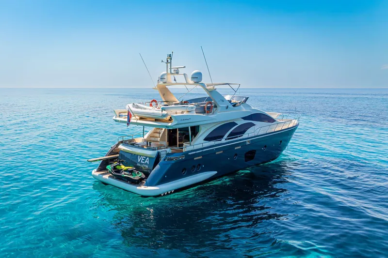 Vea Yacht Photos Pics Luxury 2008 Azimut 75 yacht on clear blue ocean waters under a sunny sky.