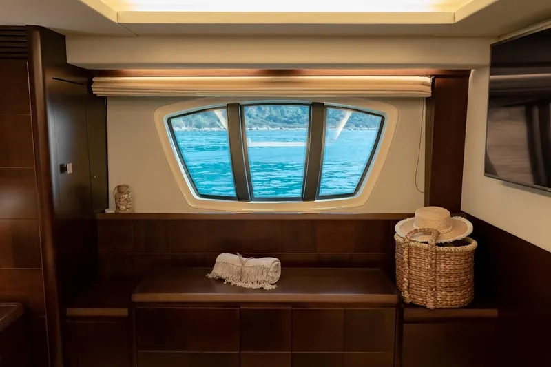Vea Yacht Photos Pics Interior view of 2008 Azimut 75 yacht with ocean view through window.