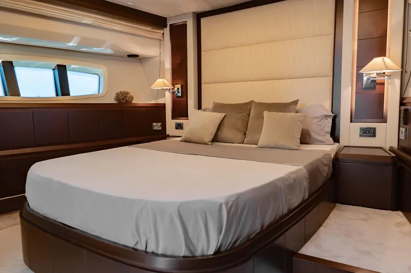 Vea Yacht Photos Pics Luxurious bedroom interior of 2008 Azimut 75 yacht with elegant bedding and ambient lighting.