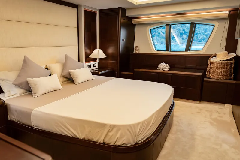 Vea Yacht Photos Pics Luxurious bedroom interior of 2008 Azimut 75 yacht with elegant furnishings and large windows.