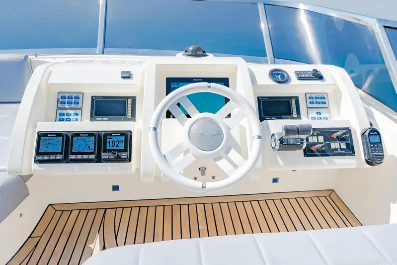 Vea Yacht Photos Pics Control panel of a 2008 Azimut 75 yacht with modern navigation instruments.