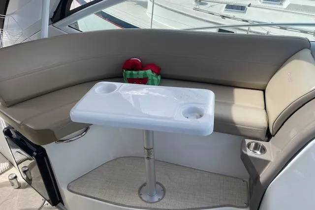  Yacht Photos Pics 2011 Cruisers Yachts 360 Express interior with seating and table.